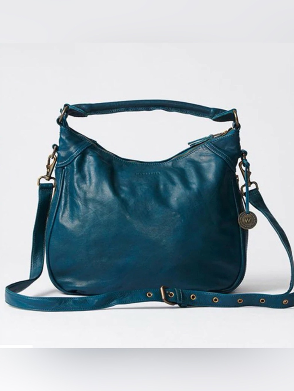Wanderers Travel Co. leather Santorini Hobo in Azzura Teal with crossbody strap
